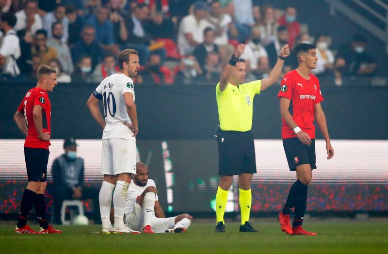 Referee Halis Ozkahya signals for a stretcher for Tottenham Hotspur's Lucas Moura during the Europa Conference League match against Stade Rennes. Reuters