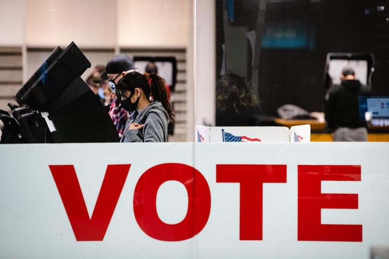 A woman casts her ballot in the 2020 general election inside the Basset Place Mall in El Paso, Texas.  AFP