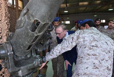 Brian Hook (C), the US special representative on Iran, listens to a Saudi official as they check what Saudi officials said was an Iranian-made launcher used by the Huthi rebels in Yemen, during a visit to an army base in al-Kharj, south of the Saudi capital Riyadh, on June 21, 2019. The US said Iran has no right to respond to diplomacy "with military force", a day after Washington said Tehran shot down a US drone over the Strait of Hormuz. "Our diplomacy does not give Iran the right to respond with military force," Hook, told reporters in Saudi Arabia.
 / AFP / Fayez WEHBE
