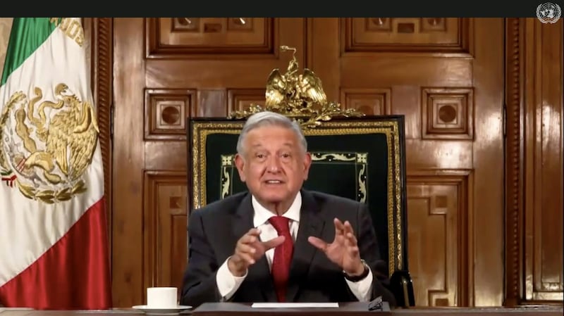 Andres Manuel Lopez Obrador, President of Mexico, sat with a clear desk bar a single coffee cup. UNTV via AP