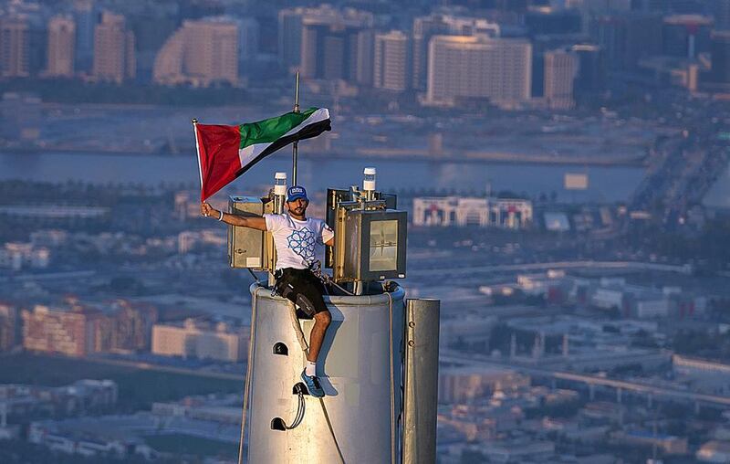 Sheikh Hamdan bin Mohammed bin Rashid, the Crown Prince of Dubai, atop of the Burj Khalifa on November 25 to mark National Day and as part of Dubai’s winning Expo 2020 campaign. Ali Hissa - personal photographer for Sheikh Hamdan / AFP Photo