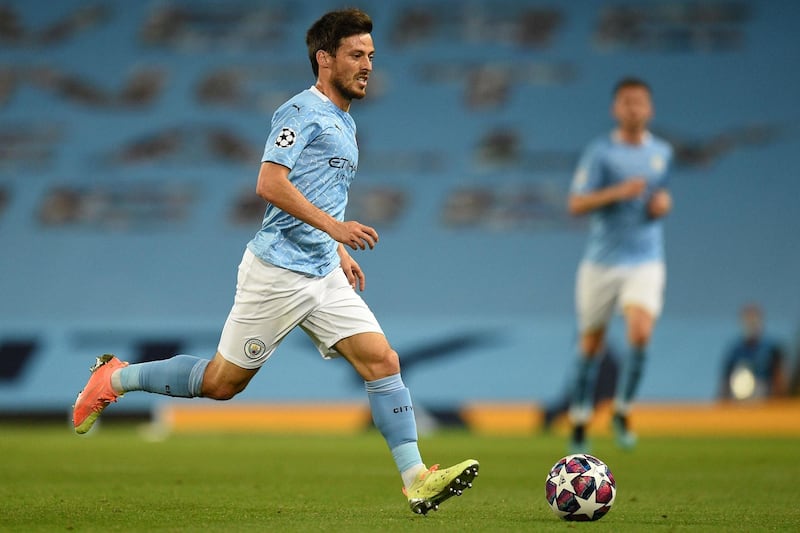 Manchester City's Spanish midfielder David Silva runs with the ball during the Champions League round of 16 second leg against Real Madrid at the Etihad Stadium on August 7. AFP