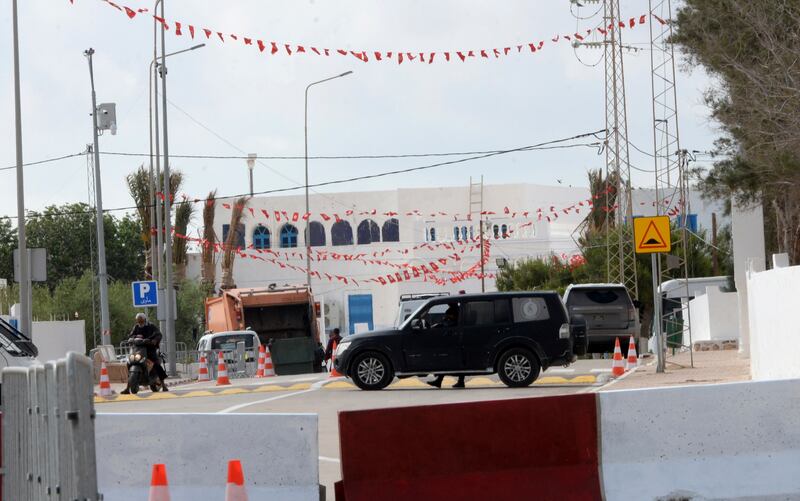 A police car is parked near Ghriba synagogue on the Tunisian island of Djerba, where five people were killed in a gun attack on Tuesday night. AP Photo 