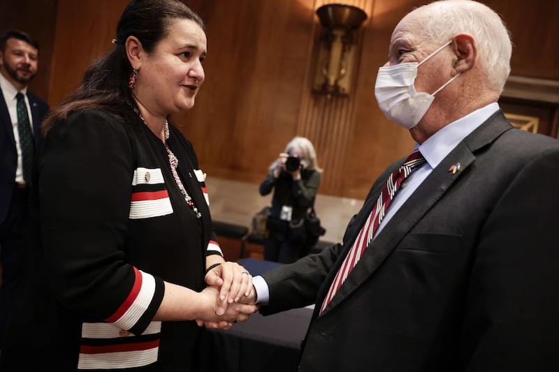 Ukraine's ambassador to the US, Oksana Markarova, greets Mr Cardin before a hearing with the Helsinki Commission in March 2022 in Washington. Getty / AFP
