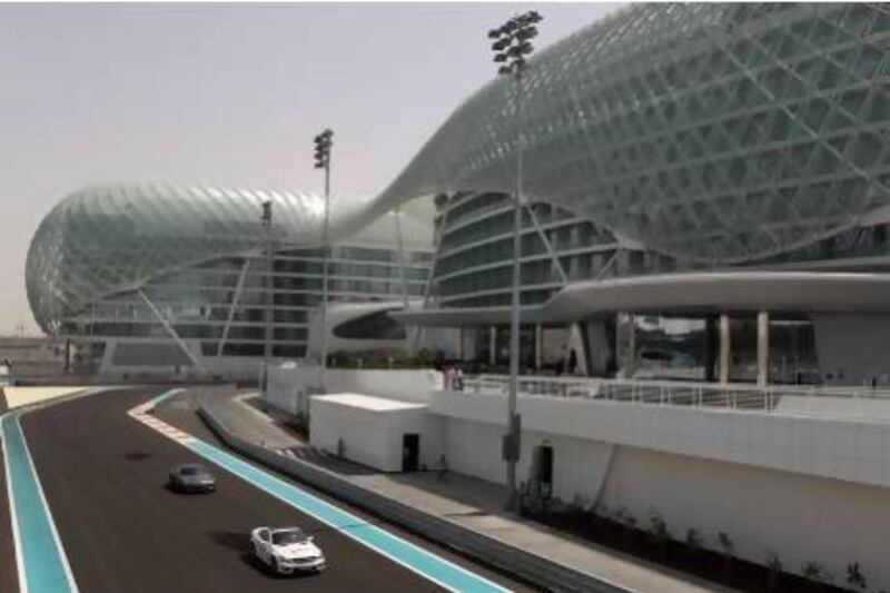 Cars race around Yas Marina Circuit, Abu Dhabi. Ian Walton / Getty Images.