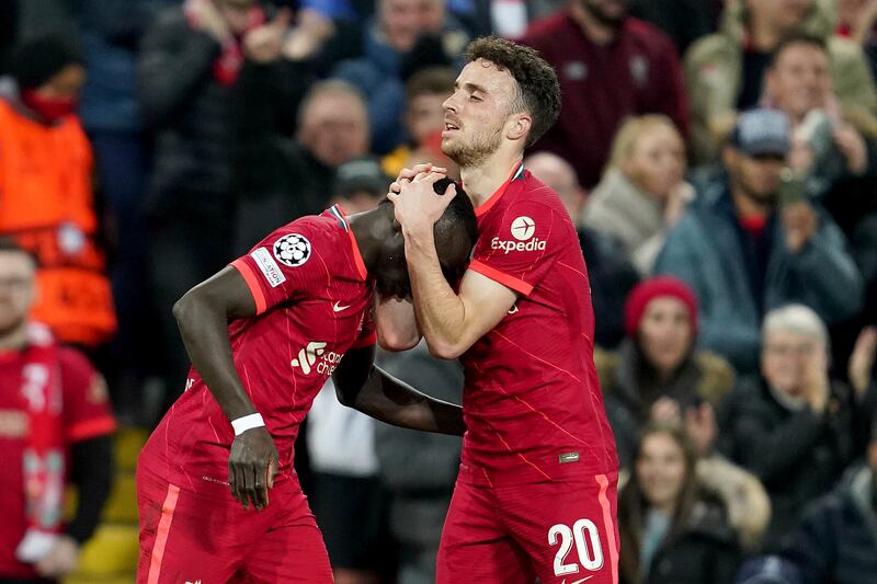 Liverpool's Sadio Mane, left, and Diogo Jota celebrate after the second goal. AP
