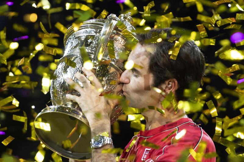 epa07954130 Switzerland's Roger Federer cheers after winning his tenth title at the Swiss Indoors tennis tournament at the St. Jakobshalle in Basel, Switzerland, on Sunday October 27, 2019.  EPA/GEORGIOS KEFALAS