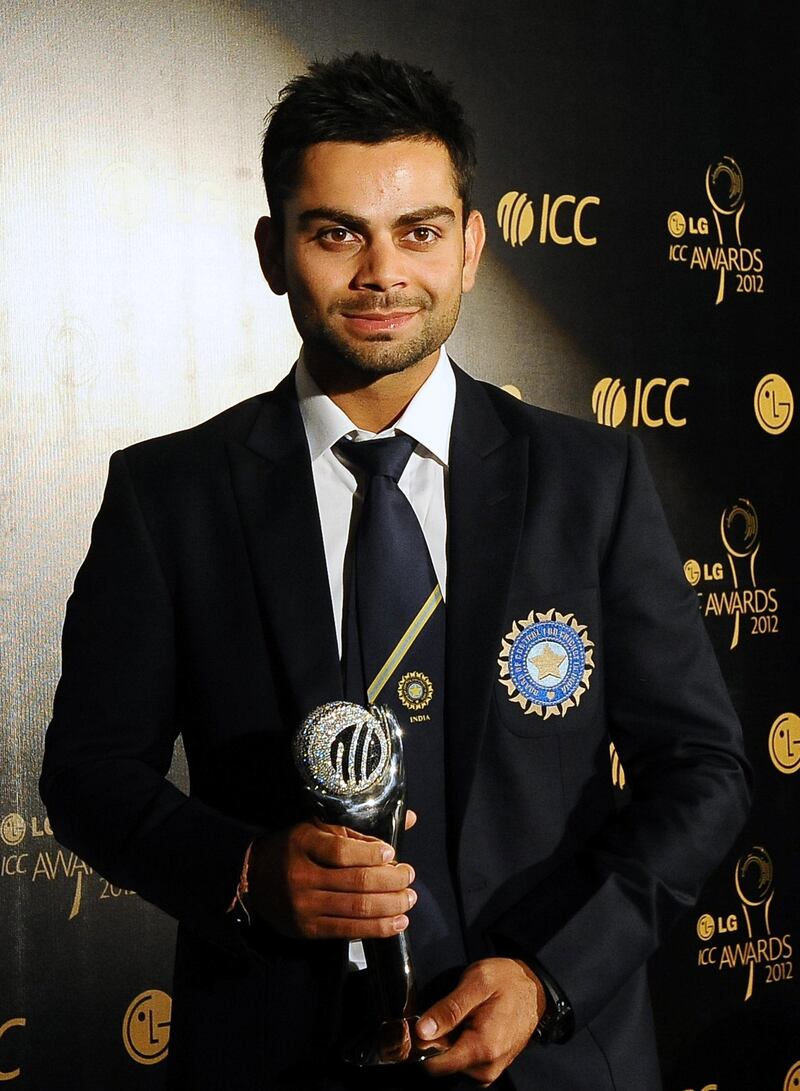 Indian cricketer Virat Kohli poses with his award after being named the ICC ODI Cricketer of the Year during the LG ICC Awards in Colombo on September 15, 2012. The LG ICC Awards recognise the major team and player achievements in international cricket on an annual basis. AFP PHOTO/ LAKRUWAN WANNIARACHCHI (Photo by LAKRUWAN WANNIARACHCHI / AFP)