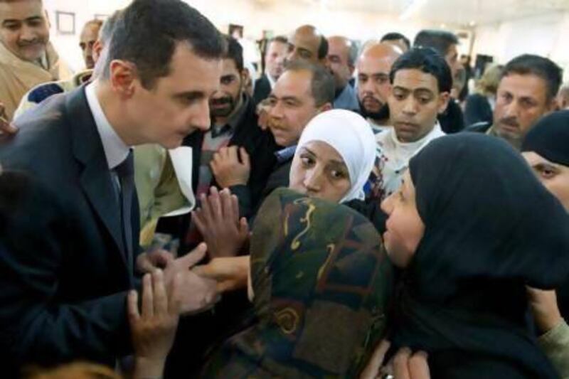 Syrian president Bashar Assad makes a surprise visit to the Educational Centre for Fine Arts in Damascus where families of students martyred as a result of terrorist acts were honoured yesterday.