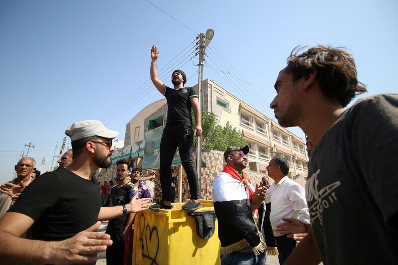 Iraqi men shout slogans during a protest in front of Basra provincial council building, demanding jobs and better state services, in Basra, Iraq July 31, 2018. REUTERS/Essam al-Sudani