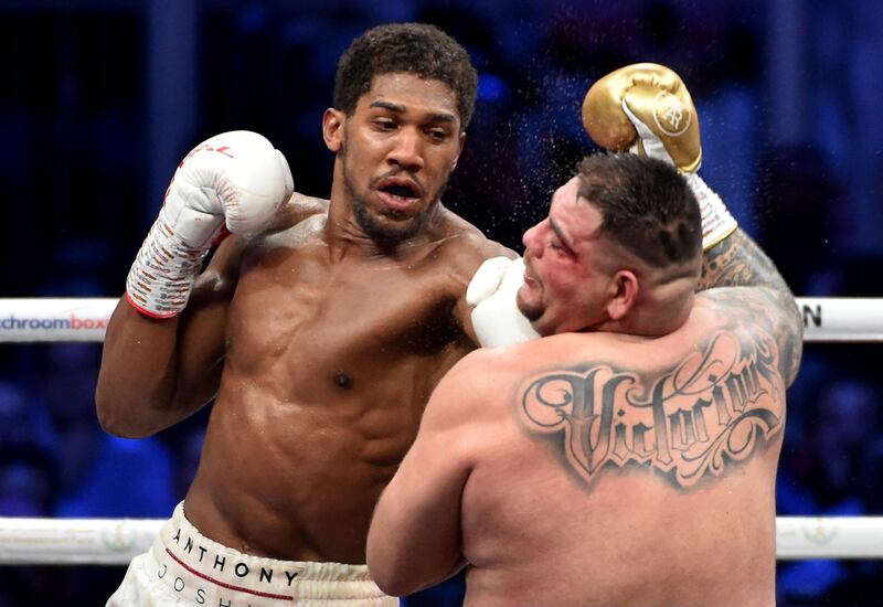 British boxer Anthony Joshua (white trunks) competes with Mexican-American  Andy Ruiz Jr in Diriya. AFP