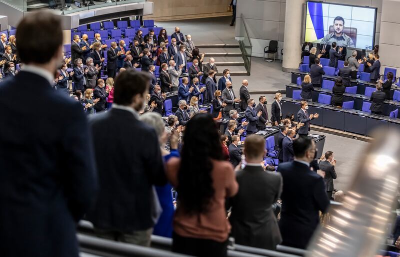 Mr Zelenskyy receives a standing ovation before he addresses the German Bundestag, in Berlin, via live video link from Kyiv in March 2022. Getty Images