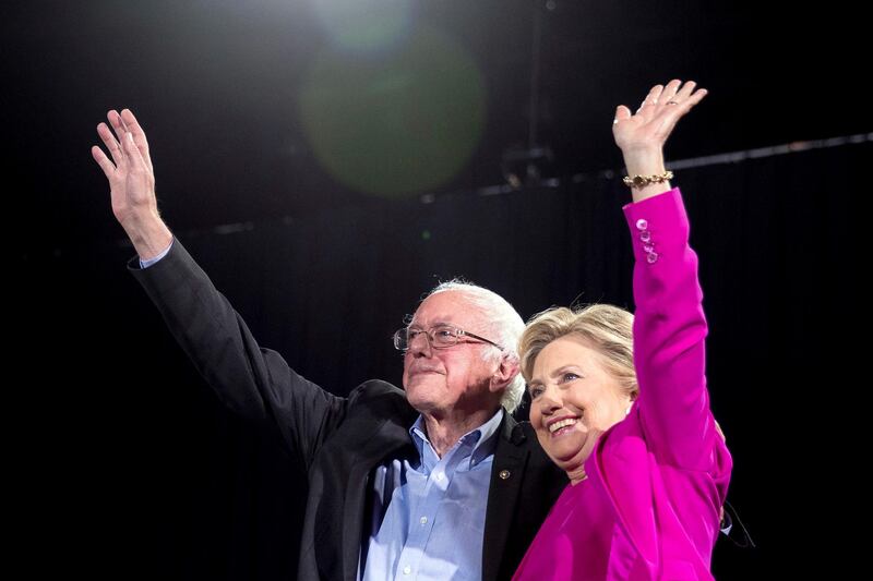 FILE - In this Nov. 3, 2016, file photo, Democratic presidential candidate Hillary Clinton and Sen. Bernie Sanders, I-Vt., appear on stage at a rally in Raleigh, N.C. Democrats are bullish about their prospects in the November midterms, and are peeking around the corner at a 2020 rematch with President Donald Trump. But first, theyâ€™re confronting the lingering frustration from 2016. That bitter nominating fight between Clinton and Sanders is front and center in Chicago as members of the Democratic National Committee gather for their 2018 summer meeting. Theyâ€™ll decide the fate of so-called superdelegates. (AP Photo/Andrew Harnik, File)