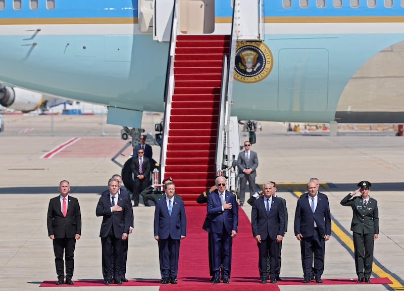 US President Joe Biden, centre, stands for the national anthems alongside Secretary of State Antony Blinken, second left, Israel's President Herzog, third left, caretaker Prime Minister Yair Lapid, third right, and departing prime minister Naftali Bennett, second right, at Ben Gurion Airport. AFP