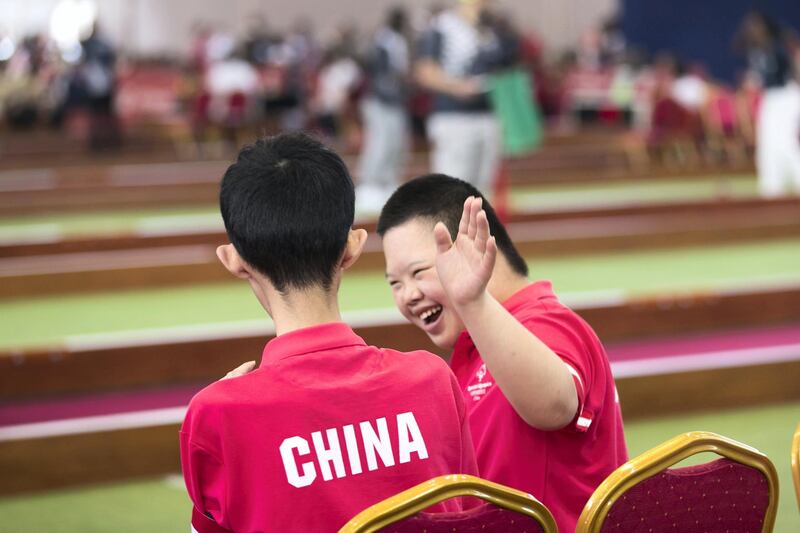 ABU DHABI, UNITED ARAB EMIRATES - March 20 2019.

Chinese bocce athlete cheers on his teammate at the bocce tournament at the Special Olympics World Games in ADNEC.

 (Photo by Reem Mohammed/The National)

Reporter: 
Section:  NA