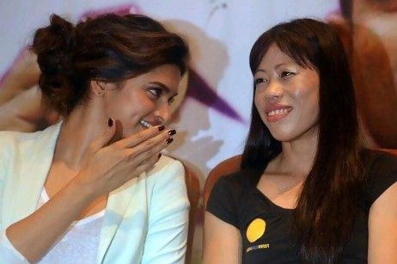 The actress Deepika Padukone and Mary Kom, right. Kom won a bronze medal at this year's London's Olympics. AFP