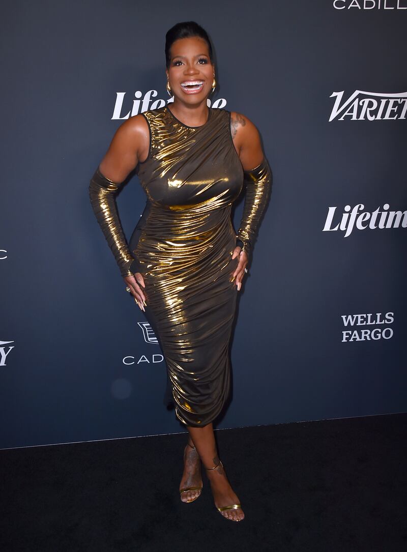 Award recipient Fantasia Barrino chose a fitted look in dark gold with matching sleeves. AP