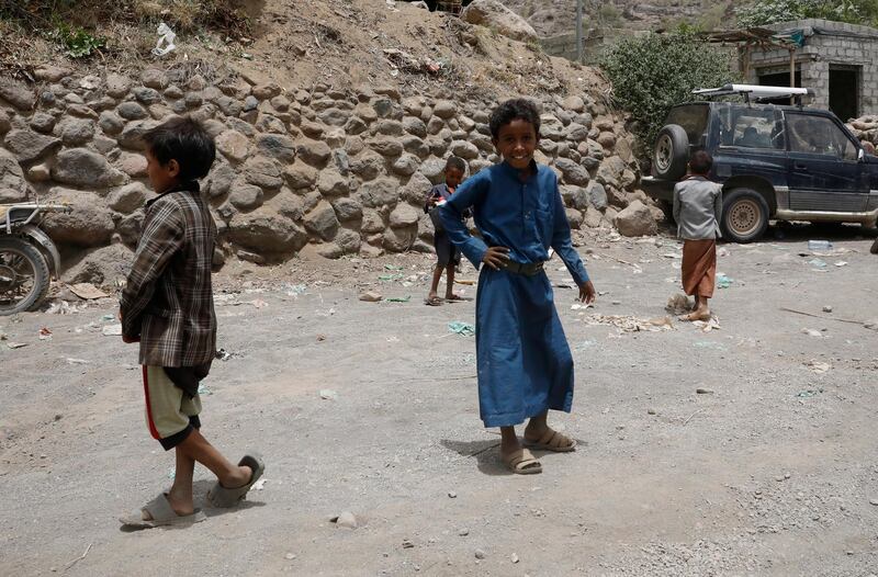 epa09284096 Yemeni children walk through a road in the remote district of Bani Matar, Sana’a, Yemen, 17 June 2021 (issued 18 June 2021). Houthi leader Mohammed Ali al-Houthi dismissed a UN decision, issued on 18 June 2021, to add the Houthi group to the blacklist of groups for violating children's rights, criticizing the UN for removing the Saudi-led coalition from the same blacklist and ignoring evidence of the coalition’s violations against children in Yemen.  EPA/YAHYA ARHAB