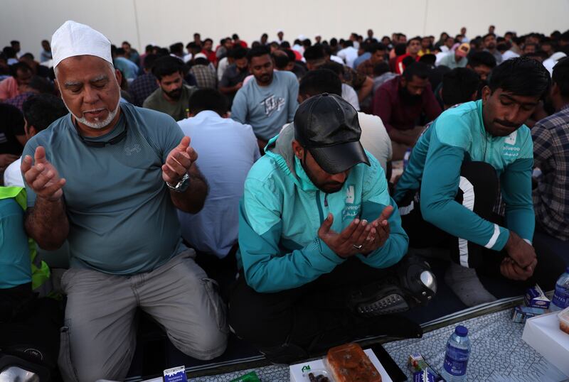 Muslims wait for sunset to end their fast outside Al Farooq Mosque in Dubai. EPA