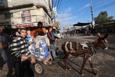 Gazans transport bags of grain on a cart in Rafah in the southern Gaza Strip. AFP