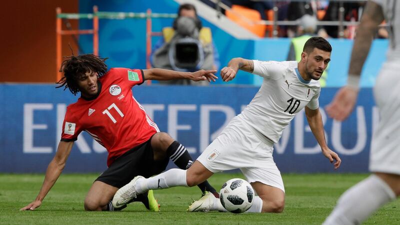 Egypt's Mohamed Elneny, left, and Uruguay's Giorgian De Arrascaeta challenge for the ball during their group A match at the 2018 FIFA World Cup at the Yekaterinburg Arena in Yekaterinburg, Russia, on June 15, 2018. Mark Baker / AP Photo