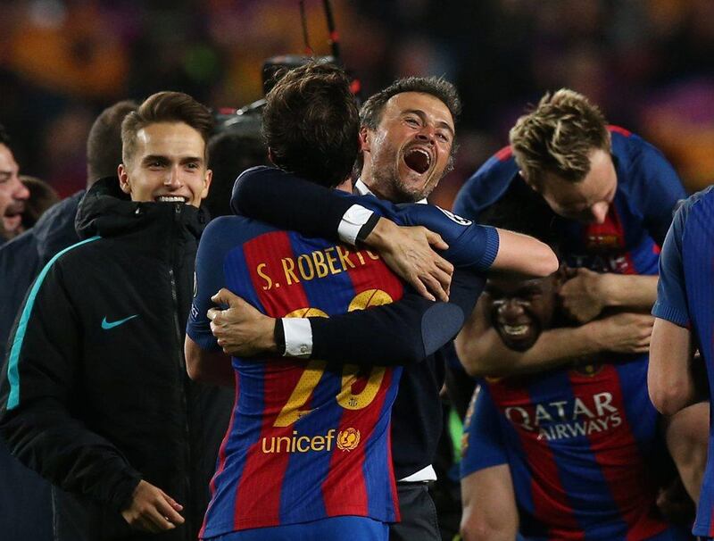 Barcelona coach Luis Enrique and Sergi Roberto celebrate after their comeback victory over Paris Saint-Germain. Albert Gea / Reuters