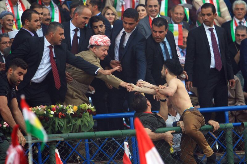 Iraqi Kurdish President Masoud Barzani shakes hands while attending a rally to show their support for the upcoming September 25th independence referendum in Duhuk, Iraq September 16, 2017. REUTERS/Ari Jalal