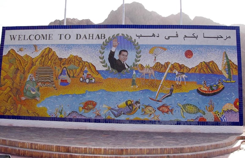 Dahab on Egypt’s Sinai Peninsula is famous for freediving but is fast becoming a bohemian enclave. Former president Hosni Mubarak remains on its sign despite his fall from power. joko / ullstein bild via Getty Images.