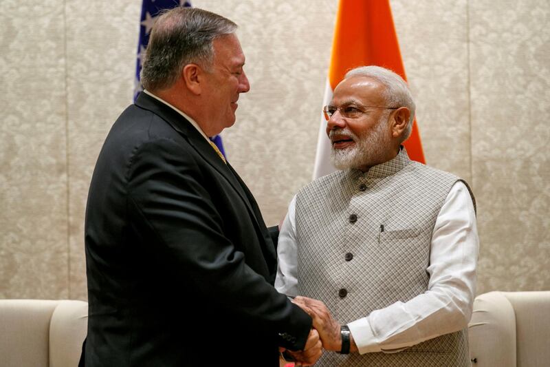 Mike Pompeo, left, shakes hands with Indian Prime Minister Narendra Modi, during their meeting at the Prime Minister's Residence in New Delhi, India. Reuters