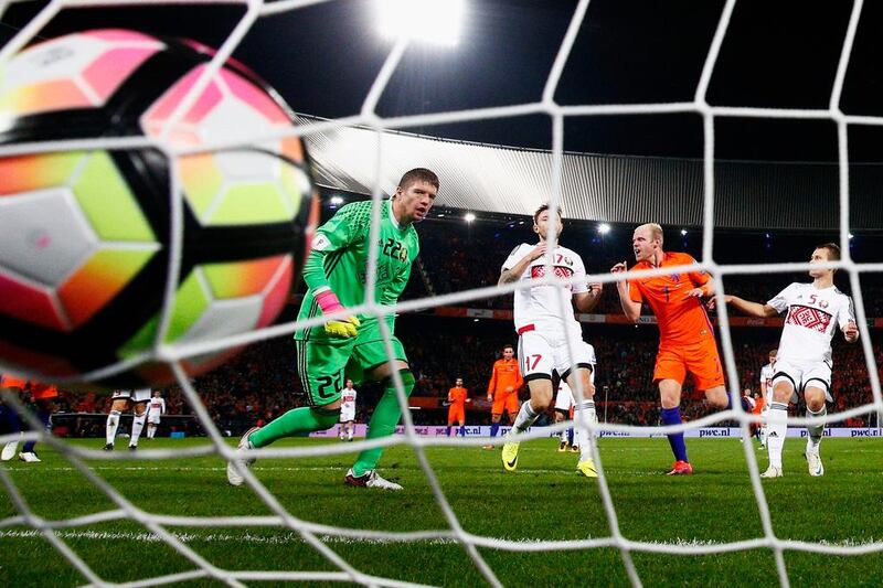 Davy Klaassen of the Netherlands shoots and scores his teams third goal of the game past goalkeeper Andrei Harbunow of Belarus during the Fifa 2018 World Cup Qualifier in Rotterdam, Netherlands. Dean Mouhtaropoulos / Getty Images