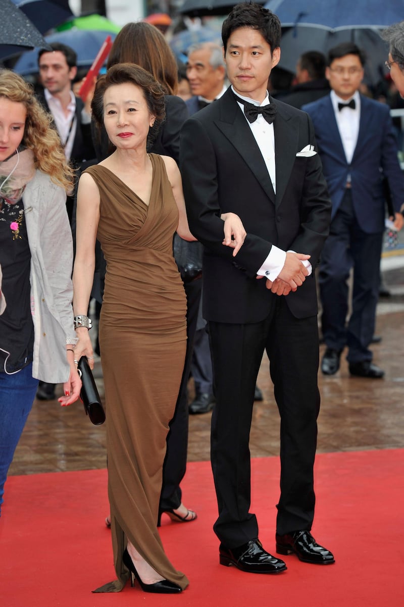 CANNES, FRANCE - MAY 21:  actor Yu Jun-Sang and actress Youn Yuh-jung  attend the "Da-reun Na-ra-e-suh" Premiere during the 65th Annual Cannes Film Festival at Palais des Festivals on May 21, 2012 in Cannes, France.  (Photo by Gareth Cattermole/Getty Images)