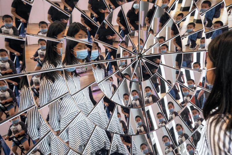 LONDON, ENGLAND - AUGUST 19: Children play in a large mirrored object at the Science Museum on it's official re-opening day on August 19, 2020 in London, England. The Science Museum reopens its doors to the public today, nearly five months after the Coronavirus pandemic shut down all public spaces. (Photo by Dan Kitwood/Getty Images)