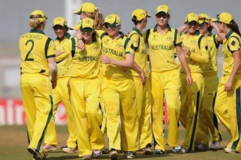 The Australia women's cricket team celebrates after winning their super six match over England held in Mumbai, India on Friday. Pal Pillai / Getty Images