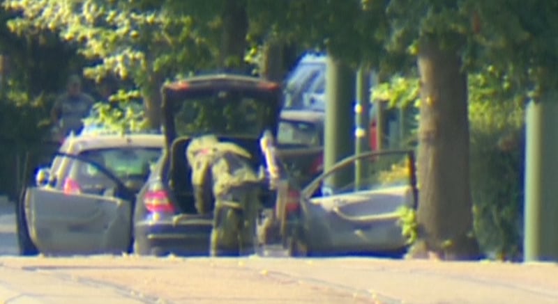 A bomb disposal expert is seen searching a car in the Brussels' commune of Woluwe St Pierre, June 30, 2018. RTL Television. TV Picture taken June 30, 2018.  Reuters TV via REUTERS  TV.  NO RESALES. NO ARCHIVE. BELGIUM OUT. BELGIUM OUT.