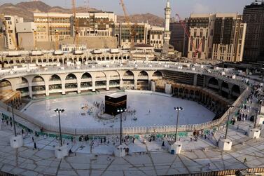 An aerial view taken on March 5, 2020 shows the white-tiled area surrounding the Kaaba, inside Mecca's Grand Mosque, empty of worshippers. Saudi Arabia today emptied Islam's holiest site for sterilisation over fears of the new coronavirus, an unprecedented move after the kingdom suspended the year-round umrah pilgrimage. / AFP / ABDEL GHANI BASHIR