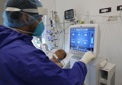 A patient who is suffering from the Covid-19 disease caused by the novel coronavirus is treated at the intensive care unit of the Geitaoui hospital in the Lebanese capital Beirut, on January 14, 2021.  A full lockdown started in Lebanon today, with residents barred even from grocery shopping and dependent on food deliveries, in a bid to slow a surge in novel coronavirus cases.
The lockdown, ordered after some hospitals started to run out of intensive care beds, includes a 24-hour curfew until January 25. / AFP / ANWAR AMRO
