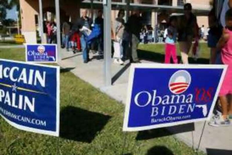 Signs for both major presidential candidates greet people after they had waited two hours in line to vote early in Pembroke Pines, Fla. Saturday, Nov. 1, 2008.  (AP PhotoJ Pat Carter)