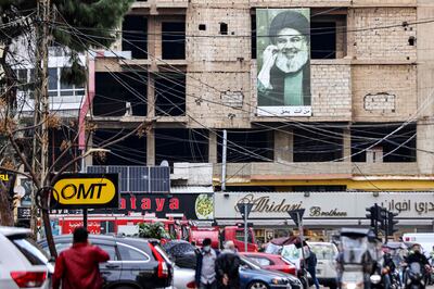 A picture depicting Hassan Nasrallah, the leader of the Lebanese Hezbollah movement, near the site of Saleh Al Arouri's death in Beirut. AFP