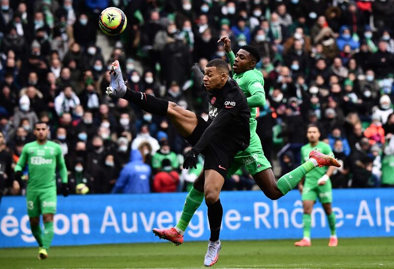 PSG forward Kylian Mbappe and Saint-Etienne defender Mickael Nade battle for the ball. AFP