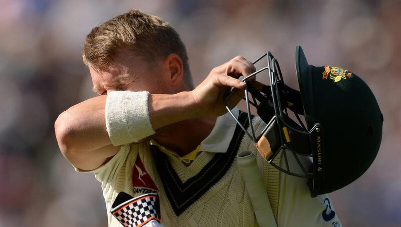 Australia’s David Warner leaves the field after being dismissed. Philip Brown / Reuters