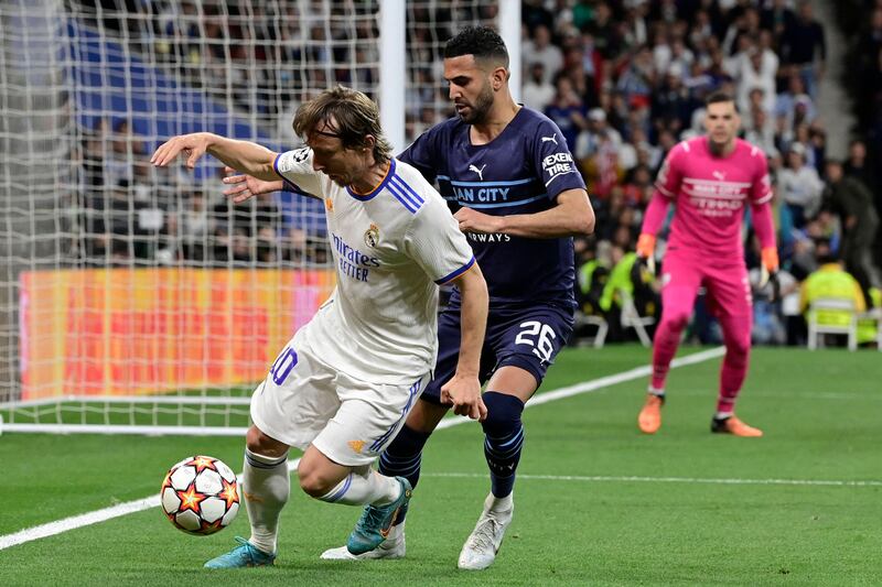 Real's Luka Modric is challenged by Riyad Mahrez. AFP