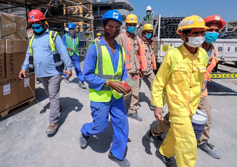 Abu Dhabi, United Arab Emirates, September 27, 2020.  Construction workers take a break at the construction site at the Al Raha Gardens, Abu Dhabi.
Victor Besa/The National
Section:  NA
Reporter:  Haneen Dajani