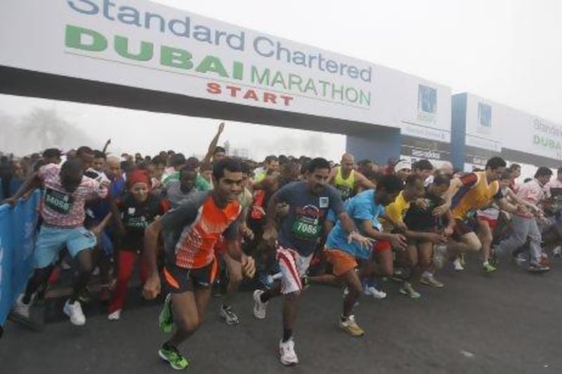 Athletes get off and running in the Standard Chartered Dubai Marathon yesterday.