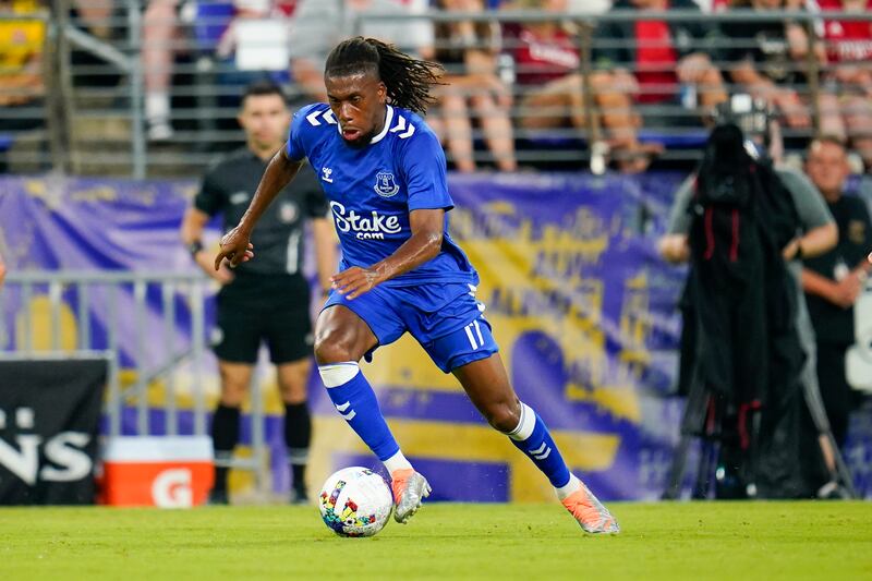 Everton midfielder Alex Iwobi runs with the ball against Arsenal. AP