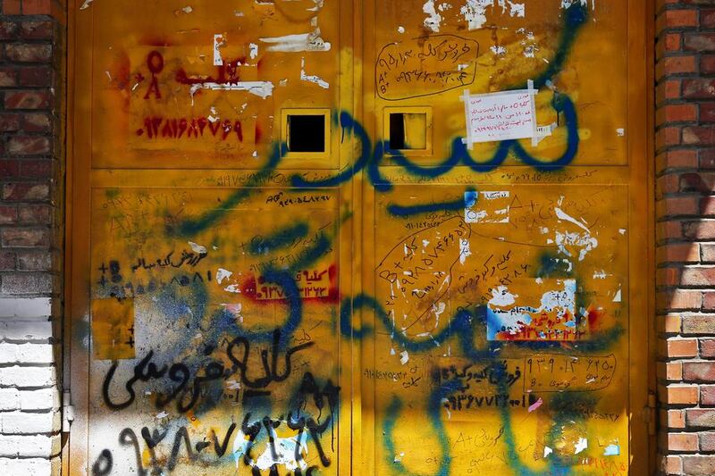 Handwritten advertisements for kidneys for sale, that include the sellers’ phone number and blood type, posted on a door in downtown Tehran, Iran. Ebrahim Noroozi/AP Photo
