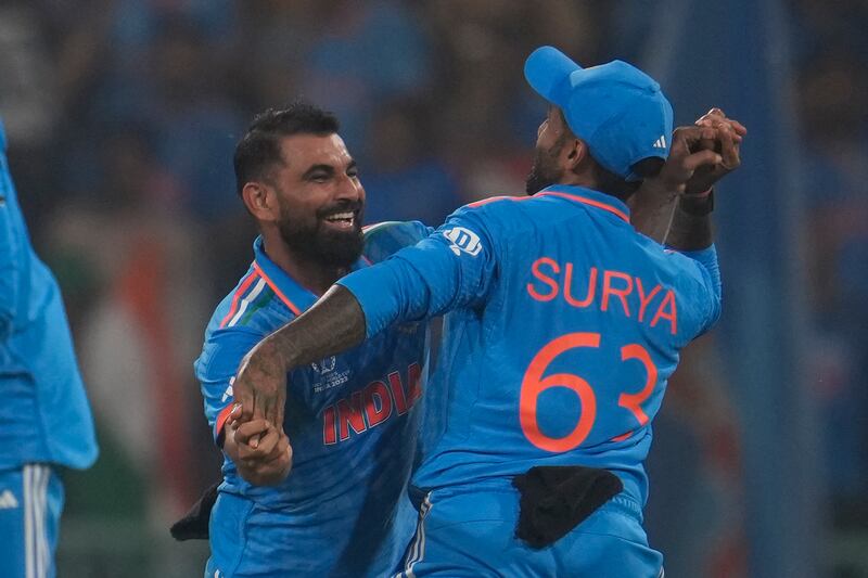 India's Mohammad Shami, left, after taking the wicket of England's Jonny Bairstow. AP
