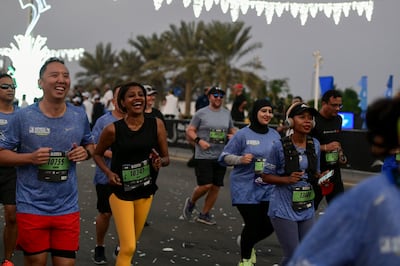 Runners at the Adnoc Marathon in Abu Dhabi. Khushnum Bhandari / The National
