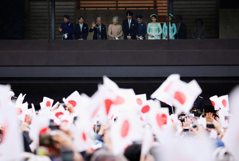 Japan's Emperor Akihito, flanked by Empress Michiko, Crown Prince Naruhito, Crown Princess Masako, Prince Akishino, Princess Kiko, Princess Mako and Princess Kako wave to well-wishers who gathered to celebrate the emperor's 85th birthday at the Imperial Palace in Tokyo, Japan. Reuters
