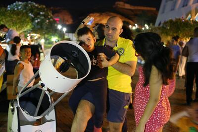 AL AIN , UNITED ARAB EMIRATES – Aug 13 , 2015 : People looking stars through telescope during the perseid meteor shower at Mercure Grand hotel Jebel Hafeet in Al Ain. ( Pawan Singh / The National ) For News.
 *** Local Caption ***  PS1308- METEOR SHOWER01.jpg