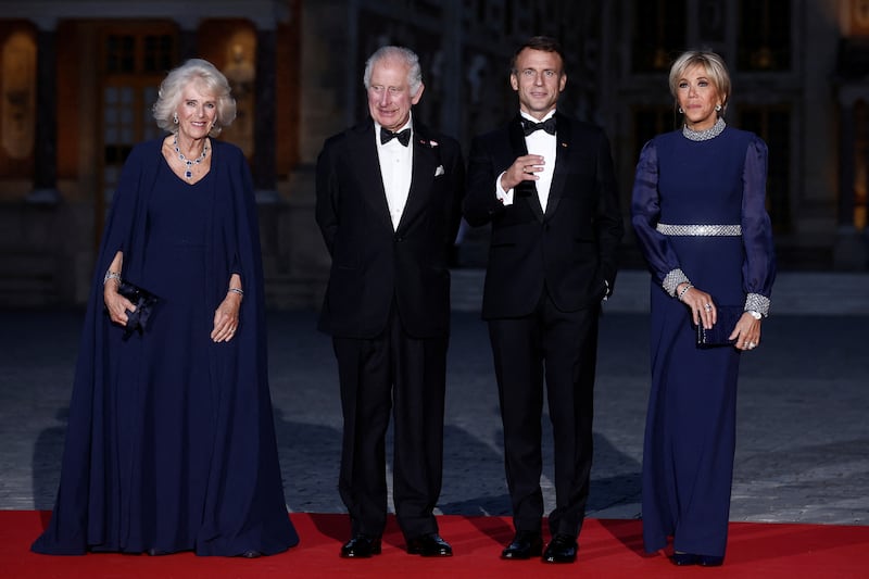 From left, Queen Camilla, King Charles, and the Macrons at the palace. Reuters